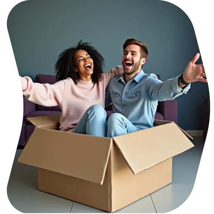 Two guys sitting on the floor of their apartment with Muval moving boxes